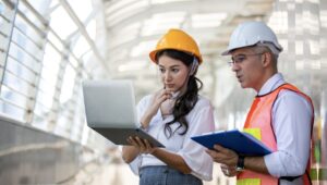 man and woman engineer in hardhats