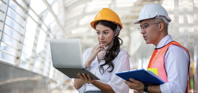 man and woman engineer in hardhats