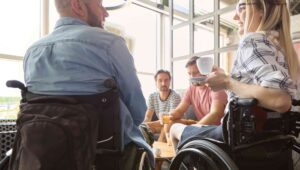 ableism-at-work people in wheelchairs talking