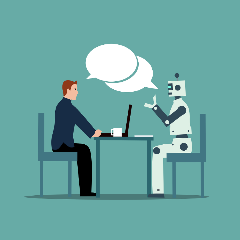 robot and person sitting at a table