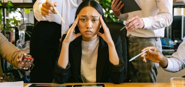 Person overworked in the office because of Talent Crunch