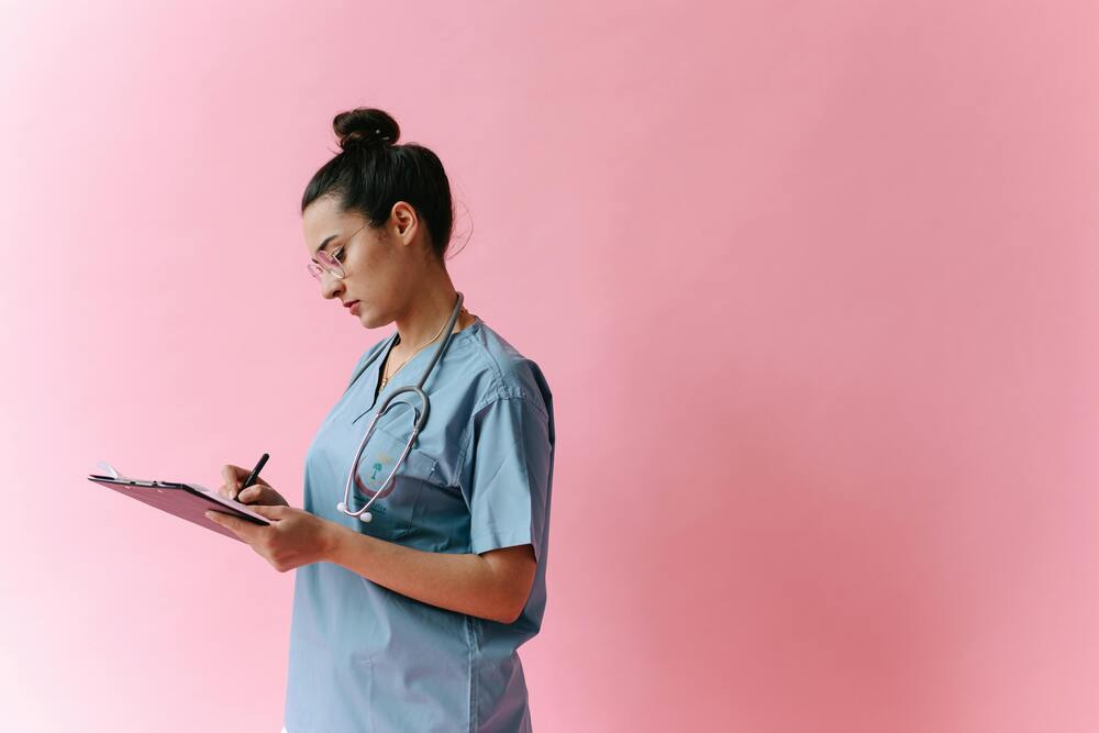 Healthcare job descriptions - Nurse checking notes