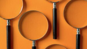 orange background with magnifying glasses