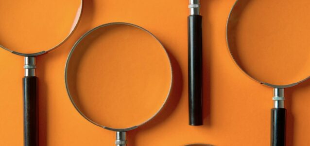 orange background with magnifying glasses