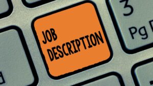 the state of job descriptions whitepaper -- keyboard with the word job description