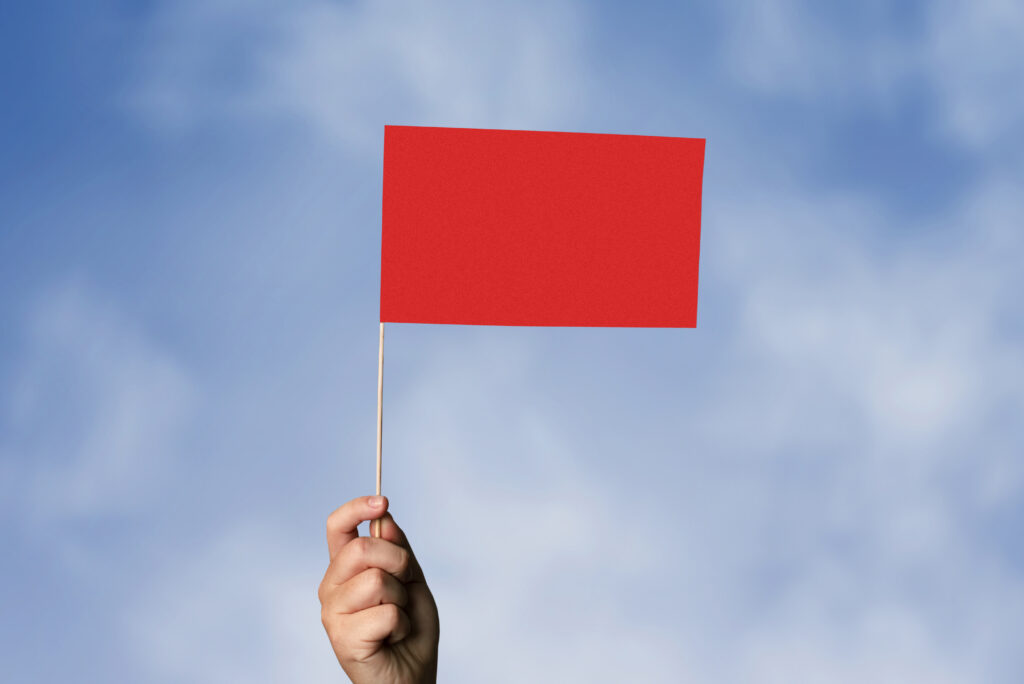 red-flag-waving | Ongig Blog red flag - how to fix bad job descriptions