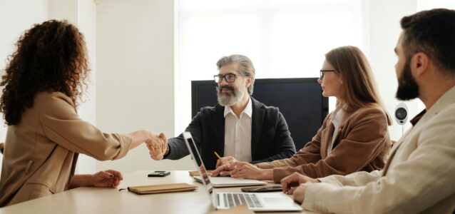 HR team at a conference table - HR paperwork